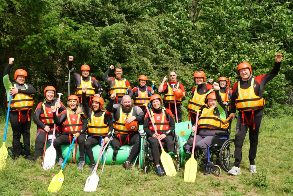Amputation foundation group photo with canoes
