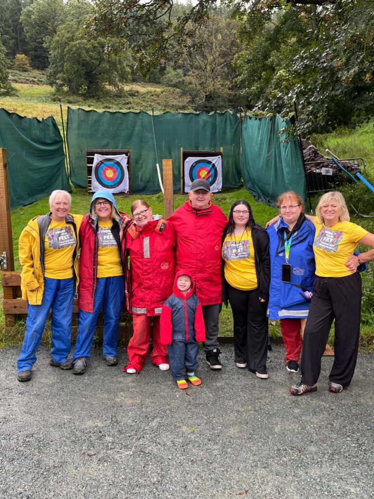 group photo at an archery range