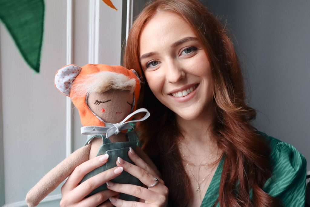 woman smiling with teddy