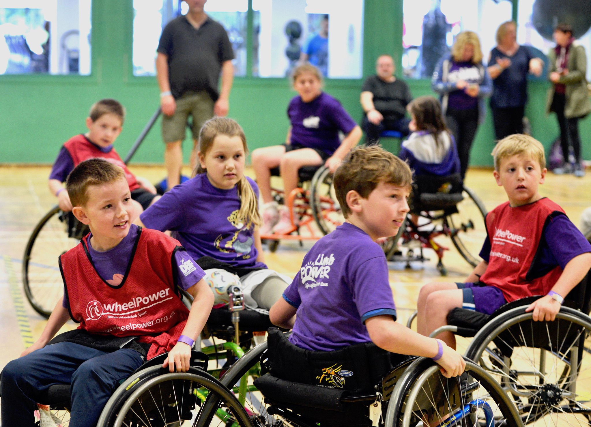 kids in wheelchairs playing basketball