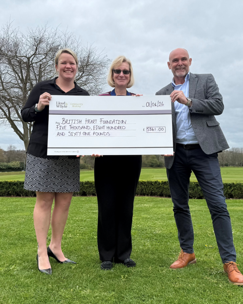 Three people proudly holding a cheque for the British heart foundation for £5861.00