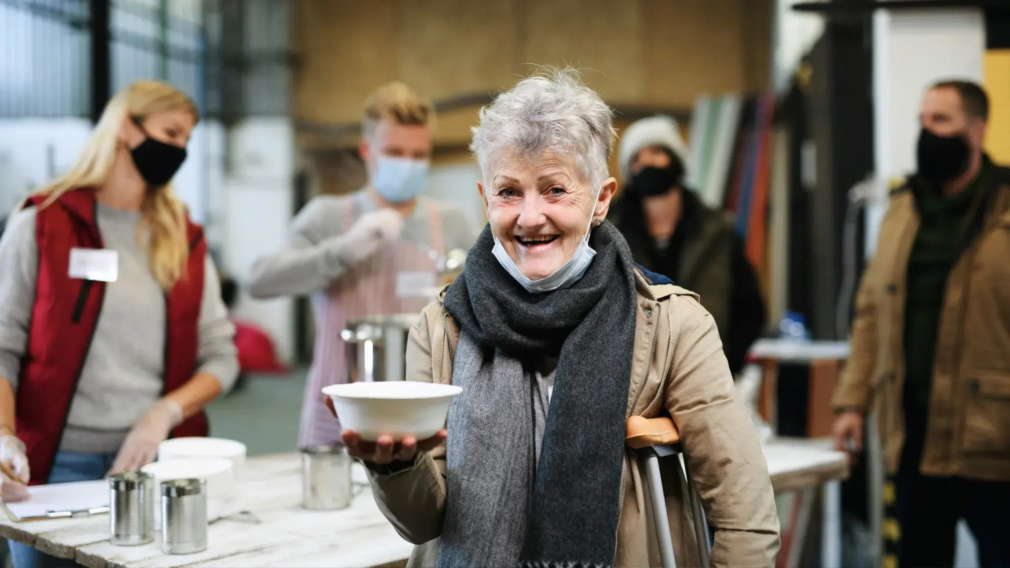 woman holding a bowl of soup